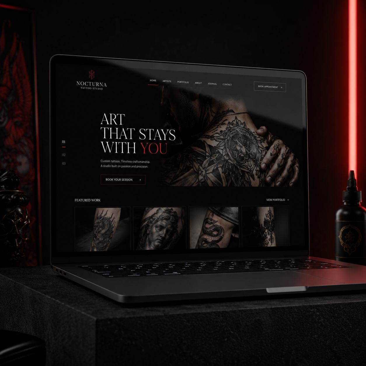 Laptop mockup showing a premium tattoo studio website